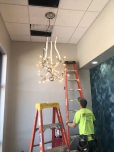 Interior installation of chandelier lighting in West river Surgical Clinic in Rapid City, SD.