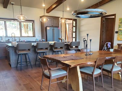 Kitchen with wood floorboards and custom lighting for Residential Electrical Services.