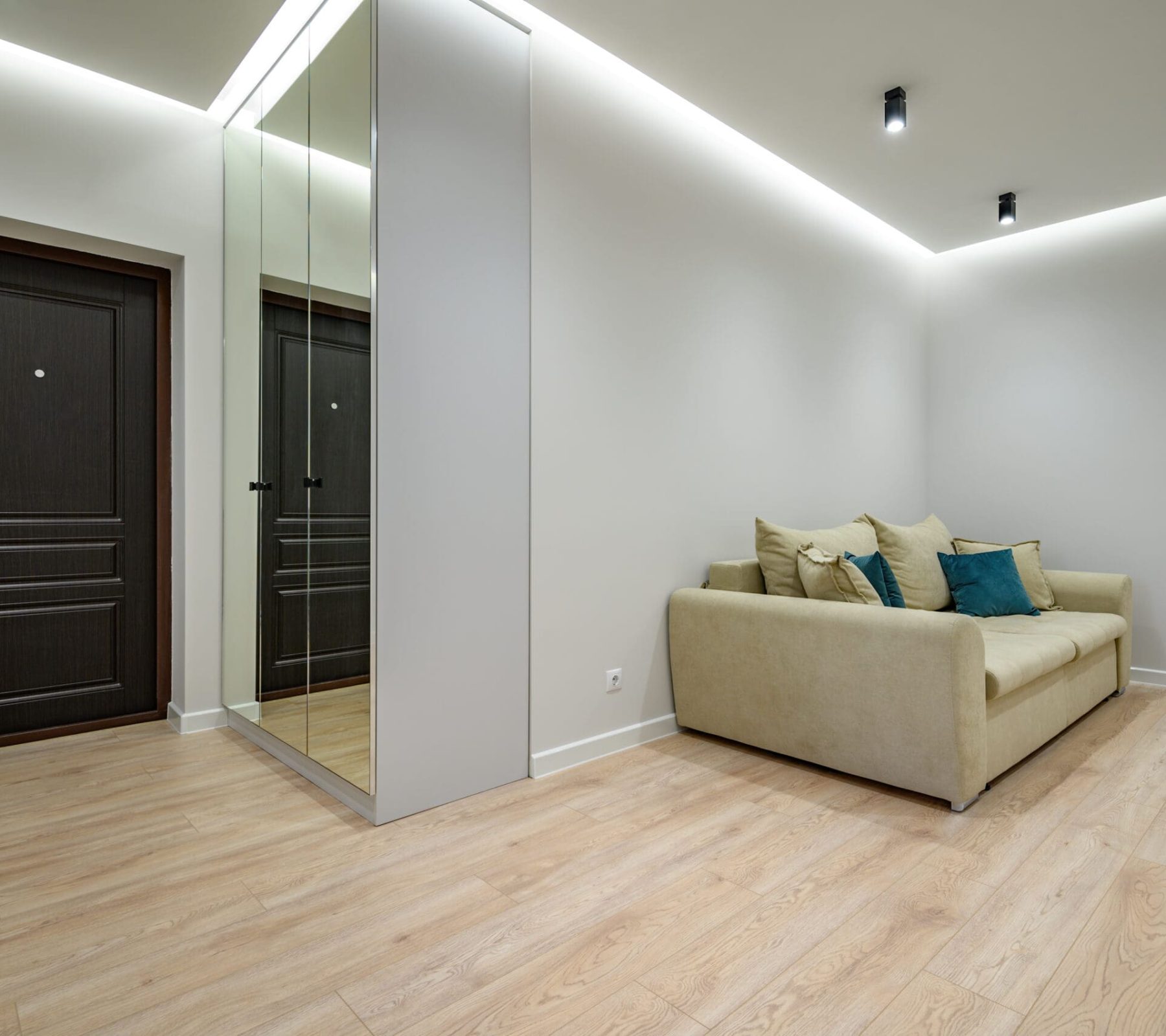 Interior of trendy classy apartment entrance hall Interior of large trendy classy apartment entrance hall with sofa and mirror